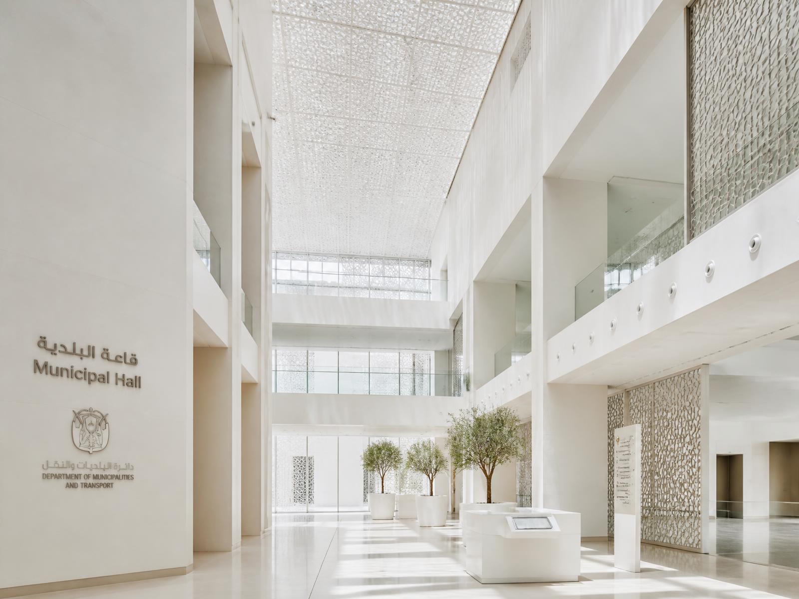 Sunlit atrium of a UAE municipal authority building